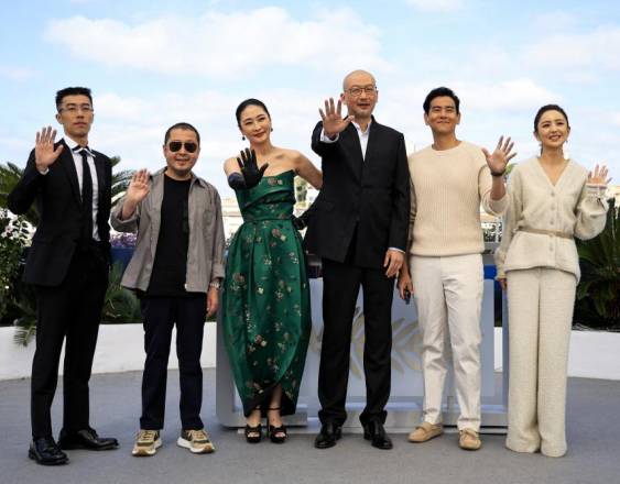 (FromL) Chinese actor Zhou You, Chinese actor Jia Zhang-ke, Chinese actor Liang Jing, Chinese director Guan Hu, Chinese actor Eddie Peng and Chinese actress Tong Liya pose during a photocall for the film Black Dog at the 77th edition of the Cannes Film Festival in Cannes, southern France, on May 18, 2024. (Photo by Valery HACHE / AFP)