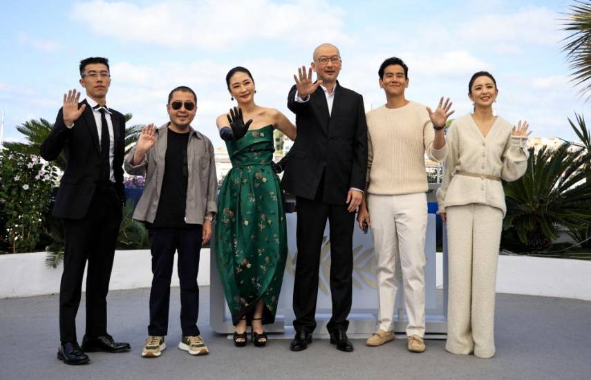 (FromL) Chinese actor Zhou You, Chinese actor Jia Zhang-ke, Chinese actor Liang Jing, Chinese director Guan Hu, Chinese actor Eddie Peng and Chinese actress Tong Liya pose during a photocall for the film Black Dog at the 77th edition of the Cannes Film Festival in Cannes, southern France, on May 18, 2024. (Photo by Valery HACHE / AFP)
