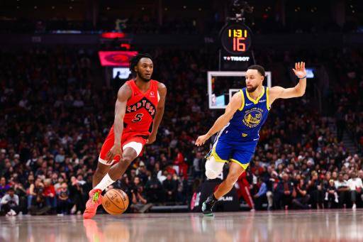 Immanuel Quickley #5 of the Toronto Raptors dribbles the ball against Stephen Curry #30 of the Golden State Warriors during first half of their NBA game at Scotiabank Arena on December 28, 2025 in Toronto, Ontario, Canada. NOTE TO USER: User expressly acknowledges and agrees that, by downloading and/or using this Photograph, user is consenting to the terms and conditions of the Getty Images License Agreement Cole Burston/Getty Images/AFP