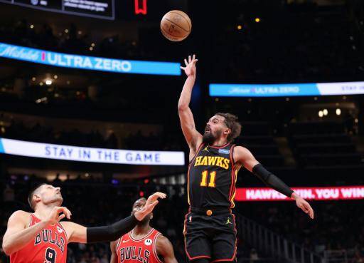 Trae Young, tras anotar una canasta por encima de dos defensores de Chicago, dice estar encantado con su traspaso de los Atlanta Hawks a Washington.