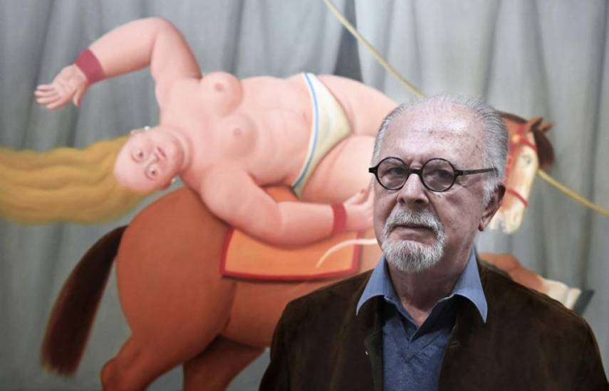 AFP | El artista colombiano Fernando Botero frente a uno de sus cuadros.